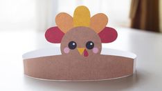 a paper turkey sitting on top of a table