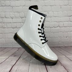 Dr. Martens 1460 Zavala Patent Leather White Combat Boot Mens Size 8/Women’s Size 9 New Without Box Unisex Us Mens Size 8 Us Women's Size 9 No Rips, No Tears, No Damages Please Understand That The Photos May Show A Slightly Different Shade Of Color Than What Would Appear In Person Due To Lighting Please Review All Pictures For Exact Details And Condition Of Shoes. The Pair In The Photos Is The Exact Pair You Will Receive. Any Questions? Pls Feel Free To Ask We Carefully Package Each Order And Sh Trendy White Boots With Rubber Sole, White Leather Ankle Combat Boots, White Flat Heel Boots For Streetwear, White Martin Boots With Round Toe For Streetwear, White Ankle Boot Combat Boots For Streetwear, White Ankle Combat Boots For Streetwear, White Martin Boots With Lug Sole For Winter, White Leather Martin Boots For Streetwear, White Leather High-top Combat Boots