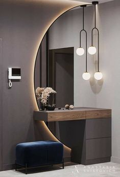 a bathroom with a vanity, mirror and stool in it's centerpieces