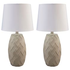 two ceramic lamps with white shades on them