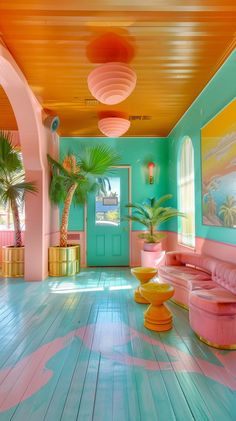 the inside of a brightly colored room with pink couches and potted palm trees