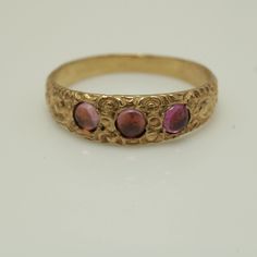 Vintage Amethyst Ring 14k Gold  The ring face is 4.46 mm across The ring size is 2.75 but it can be sized at a low cost This ring was made from the master from the 1920s It's comes with a new ring box Item number 5862 Antique Three Stone Round Rings, Vintage Engraved Stackable Round Ring, Antique 14k Stamped Amethyst Ring, Yellow Gold Ruby Ring With Three Stones, Yellow Gold Three Stone Ruby Ring, Yellow Gold Topaz Ring With Three Stones, Three-stone Yellow Gold Ruby Ring, Three Stone Round Ruby Ring In Yellow Gold, Antique Hallmarked Round Birthstone Ring