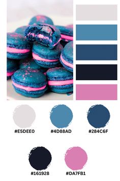 some blue and pink macaroons are stacked on top of each other