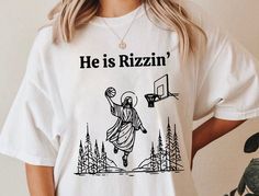 He Is Rizzin' Trendy 90s Shirt, Funny Jesus Shirt, Humor Easter Shirt, Funny Meme Gift, Jesus Playing Basketball, Christian Shirt Thank You for Visiting. ...HOW TO ORDER... 1- Please check all the listing images. 2- Please choose your shirt size and color. 3- Please click add to cart. For multiple items, you need to add each item to the cart separately, each item is sold separately. 4- Please Proceed to checkout, follow the prompts for the payment and all done! 5- We will make your order ready to ship in 1-3 business days. 6- One listing offers different product types (like Sweatshirts, T-shirts etc..) Please make sure to choose the correct one, we are not responsible with miss-selected items. -----SHIRTS & MATERIALS & SIZING----- * We work with different T-shirt brands depending on the av Funny Jesus Shirts, Funny Christian Shirts, Jesus Playing Basketball, Funny T Shirts Humor, Hilarious Shirts, Christian Products, Funny Jesus, Jesus Funny, Creative Clothes