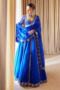 Shop for Vvani by Vani Vats Blue Satin Organza Mirror Embroidered Lehenga Set for Women Online at Aza Fashions Vani Vats, Blue Pre-draped Saree With Gota Work For Reception, Blue Pre-draped Saree With Gota Work For Wedding, Blue Choli With Gota Work For Wedding, Royal Blue Choli For Wedding And Navratri, Royal Blue Unstitched Sets For Diwali, Blue Dupatta With Mirror Work In Traditional Drape, Royal Blue Sets With Unstitched Blouse For Diwali, Royal Blue Indian Outfit