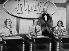 four people sitting at desks in front of a sign that says fo baby