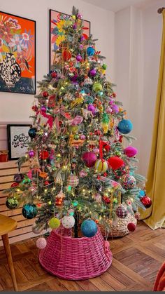 a brightly colored christmas tree in a living room