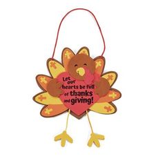 a turkey ornament hanging from a string with the words, dear hearts be full of thanks and giving