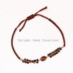 PRODUCT DETAIL :ITEM :  TIGER EYE AND BLACK SPINEL BEADED BRACELETITEM CODE :  DGC2552ITEM NAME :BRACELETGEMSTONE :  TIGER EYE AND BLACK SPINELBEADS SHAPE :   FACETED ROUNDLENGTH :   ADJUSTABLEBEADS SIZE: 3 MM APPROXWEIGHT :  58 Cts. APPROXCUSTOMIZATION/BULK ORDER : AVAILABLEPLEASE FEEL FREE TO CONTACT IF YOU REQUIRE ANY FURTHER INFORMATION. Brown Beaded Spiritual Friendship Bracelets, Spiritual Brown Beaded Friendship Bracelets, Brown Hand-strung Friendship Bracelets With Round Beads, Brown Friendship Bracelets With Round Hand-strung Beads, Adjustable Hand Wrapped Brown Beads, Adjustable Evil Eye Bracelet With Gemstone Beads, Adjustable Brown Beaded Bracelet With Gemstone Beads, Adjustable Brown Gemstone Beaded Bracelets, Adjustable Brown Beaded Bracelets With Black Beads