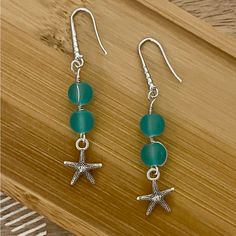 New Pretty Frosted Aqua Blue Bead Starfish Earrings With 925 Silver Ear Wire Hooks. Earrings Are 2 1/4 Inches Long Silver Round Bead Earrings For Beach, Silver Ocean-inspired Earrings With Starfish Charm, Ocean-inspired Silver Earrings With Starfish Charm, Silver Star-shaped Beaded Earrings, Nickel-free Silver Beaded Earrings For Beach, Silver Drop Earrings With Starfish Charm, Nickel Free Silver Beaded Earrings For Beach, Blue Starfish Charm Earrings For Gift, Silver Starfish Shaped Beaded Jewelry