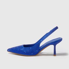 A perfect blend of elegance and style. These pointed slingback pumps feature stunning royal blue satin adorned with shimmering rhinestones, adding an exquisite touch to your ensemble. The manageable heel offers comfortable wear, making them ideal for any classy party or event. The secure slingback strap ensures a perfect fit, while the pointed-toe design lends a timeless appeal. These shoes are not just footwear, but a statement piece that can elevate any outfit, bringing sophistication and glam Blue Pumps Heels, Royal Blue Pumps, Royal Blue Heels, Classy Party, Cowboy Shoes, Dance Heels, Boots Square Toe, Classy Shoes, Blue Pumps