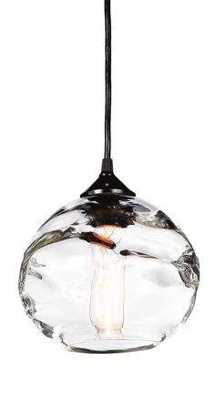 a glass light hanging from a ceiling fixture