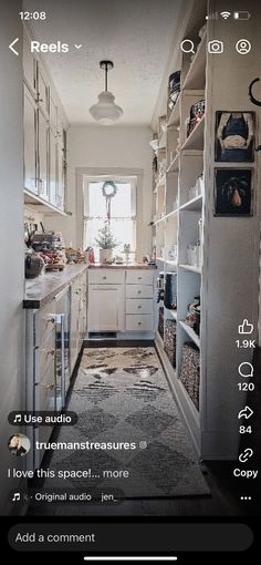 an image of a long narrow kitchen with lots of storage space on the walls and floor