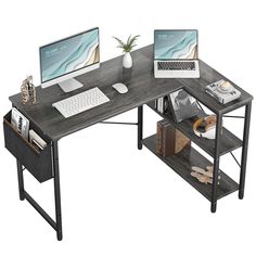 a computer desk with two computers on it