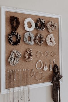 a cork board with various hair accessories on it