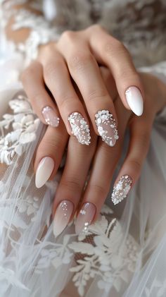 a woman's hands with white and silver manies