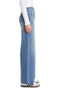 Whiskering and sanding add edginess to these stretch-kissed jeans featuring a wide leg and faded indigo wash. 33" inseam; 25" leg opening; 10 1/2" front rise; 15 1/2" back rise 56% cotton, 22% REPREVE® recycled polyester, 21% rayon, 1% spandex REPREVE recycled polyester is made from 100% post-consumer recycled plastic bottles Machine wash, tumble dry Imported Faded Wide Leg Washed Flare Jeans, Faded Full Length Denim Flare Jeans, Chic Wide Leg Faded Jeans, Washed Blue Wide Leg Denim Flare Jeans, Wide Leg Washed Blue Denim Flare Jeans, Stretch Wide Leg Washed Jeans, Faded Wide Leg Cropped Jeans, Wide Leg Stretch Jeans With Washed Details, Faded Wide-leg Flare Jeans For Spring