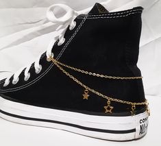 "I am very sorry to say that I will no longer be able to ship packages to Germany. If an order from Germany is placed, I will cancel and refund the order. Thank you for understanding. Add some dazzle to your shoes or boots! This design features 2 gold plated chain strands with 7 gold plated of cut-out and solid shaped metal star charms attached along the bottom chain. This listing is for 1 shoe (or boot) chain. If you want chains for both shoes (or boots) you will need to order 2. There are 3 di Shoes Accessories Ideas, Shoe Chains Diy, Converse Chain, Converse Charms, Accessories For Outfits, Boots With Stars, Star Laces, Shoe Chains, Shoes Chain