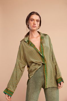 For Kings and Queens. Our Oriental Motif long-sleeve shirt is a luxurious dream. This soft, flowy texture drapes effortlessly and exudes timeless sophistication. Breathable with a silky touch. Available in both Jade Green and Burnt Sienna, this piece offers a harmonious blend of sophistication and versatility. Perfect for both professional and social occasions. 100% Recycled Japanese PL (Silky Touch) Hand Wash or Gentle Machine Wash & Hang Dry. Festive Tops With Blouson Long Sleeves, Festive Top With Blouson Long Sleeves, Festive Long Sleeve Top With Blouson Sleeves, Chic Silk Blouse For Festive Occasions, Festive Long Sleeve Blouse With Blouson Sleeves, Green Silk Tops For Fall, Elegant Green Fall Shirt, Elegant Green Long Sleeve Shirt, Elegant Long Sleeve Green Shirt