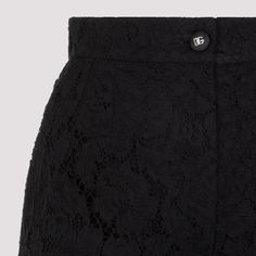 Dolce & Gabbana Black Cotton Lace Pants. Crafted in cotton, elastane, polyamide and viscose blend. High-waisted, front zipped fastening, front logoed buttoned fastening, wide legs, asymmetric hem. Partially lined. Elegant Fitted Shorts, Lace Pants, Feminine Chic, Pleats Please Issey Miyake, Balenciaga Designer, Wide Legs, Ruched Dress, Yoga Wear, Cotton Lace