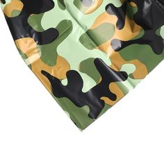 a green, yellow and black camouflage print bag