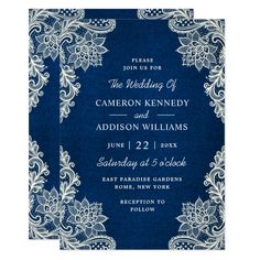 a blue and white wedding card with an ornate frame on the front, surrounded by flowers