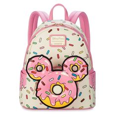 Loungefly Disney Eats Mickey Mouse Donut Mini Backpack Fans of the delicious Parks donuts will be sweet on this mini backpack inspired by the popular treat. One of the Mickey icon-shaped glazed desserts serves as an exterior pocket on this simulated leather bag from Loungefly. The front donut and the whole bag is covered in colorful sprinkles. Looking good enough to eat, it'll make you hunger for your next trip to the Parks. Simulated leather backpack Round exterior zip pocket with padded die-cut vinyl Mickey icon donut front panel Allover sprinkles print Zip closure with double zip pull Side slip pockets Goldtone hardware Adjustable padded shoulder straps Top carry loop Lining features allover Mickey icon donut print Disney Eats label Disney Parks x Loungefly logo label plate Polyurethane Glazed Desserts, Loungefly Purse, Disney Eats, Loungefly Mini Backpack, Cute Mini Backpacks, New Mickey Mouse, Mini Mochila, Loungefly Bag, Disney Handbags