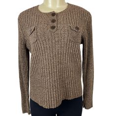 This Vtg Ralph Lauren Women's Brown Sweater in size L offers classic style. It's perfect for fall or winter and features a comfortable, modest design with long sleeves, three chest buttons, and two buttoned chest pockets. Made from a luxurious blend of silk and cotton. It is in excellent used condition with no holes, rips, or stains. Please refer to the pictures for details. Measurements are shown in the last image. * Ralph Lauren brand  * Women's size L  * Brown color  * Sweater style  * Ideal for fall/winter  * Comfortable, modest design  * Long sleeves  * Three chest buttons  * Two buttoned chest pockets  * Made from silk and cotton Measurements: (Taken Flat)         Shoulders 16 in / 41 cm         Chest (armpit to armpit) 19 in / 48 cm         Waist 18 in / 46 cm         Hips 19 in / 4 Ralph Lauren Luxury Long Sleeve Sweater, Ralph Lauren Luxury Winter Sweater, Luxury Brown Sweater With Pockets, Luxury Ralph Lauren Winter Sweater, Luxury Ralph Lauren Long Sleeve Tops, Luxury Long Sleeve Ralph Lauren Sweater, Luxury Brown Button-up Sweater, Luxury Ralph Lauren Classic Sweater, Luxury Long Sleeve Tops By Ralph Lauren