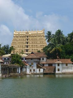 a very tall building sitting on top of a lake