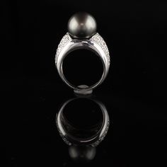 Beautiful Tahitian Pearl Ring with approximately 1 ct of round diamonds. Item #JP-R0043 Metal: 14K White Gold Weight: 12.6 Grams Total Diamond Weight: Approximately 1 cts Diamond Color: H Diamond Clarity: SI1 Pearl Measurements: 12.2 mm Ring Size: 7 (sizable) This ring can be sized for a $50 fee! *Please note that we cannot accept returns on sized rings* Measurements: 10.6 x 14.9 mm Layaway: For your convenience, we will be happy to provide layaway payment options. Please contact us to work out Tahitian Pearl Ring, Wedding Band Engraving, Engraved Wedding, Gold Engraving, Emerald Engagement, Tahitian Pearls, Emerald Engagement Ring, Diamond Cluster Ring, Diamond Color