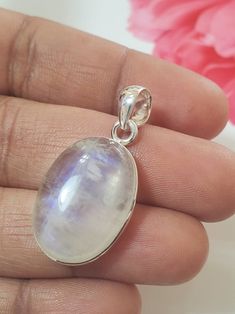 "Rainbow Moonstone Pendant Handmade Pendant Solitaire Pendant Boho Pendant Round Pendant 10X16mm Pendant Moonstone Pendant For Women's    ABOUT~ PENDANT ✦Type : Handmade item ✦Materials: 925 Sterling Silver  ✦Gemstone: Rainbow Moonstone  ✦Stone Size: 10.00X16.00mm ✦Setting : Bezel Setting ✦Product Weight : 5.15gm (Approx)  ~O U R Q U A L I TY ~ ✦Best Quality  ✦Made By 925 Sterling Silver ~ABOUT GEMSTONE ~  A stone for \"new beginnings\", Moonstone is a stone of inner growth and strength. It soothes emotional instability and stress, and stabilises the emotions, providing calmness. Moonstone enhances intuition, promotes inspiration, success and good fortune in love and business matters. ~C U S T O M I Z E O R D E R~ We accept custom and personalized order.  Please send us message if you are Spiritual Round Stone Setting Jewelry, Round Gemstones With Stone Setting Gift, White Oval Stone Set Jewelry, White Oval Stone Setting Jewelry, Healing White Moon Phase Jewelry, White Moonstone Jewelry With Moon Charm, Moon Phase Moonstone Pendant Jewelry, Moon-shaped Moonstone Healing Jewelry, Moon Shaped Moonstone Healing Jewelry