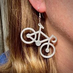 Great for bike lovers! These earrings have been custom 3D printed to delight you.  3D design created by one of our kids! We use nickel-free silver plated earring hooks.  These are made from biosourced, non-toxic, and biocompatible PLA. 3d Print Earrings, 3d Printed Earrings, Printed Earrings, 3d Printed Jewelry, Printed Jewelry, Bike Lovers, Earring Hooks, Ear Wire, In 3d