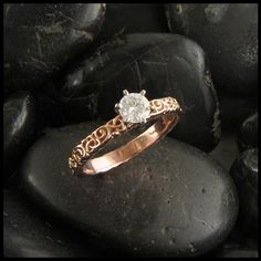 a close up of a ring on some rocks