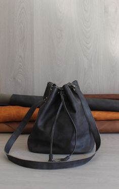 👜 Introducing our exquisite handmade leather bucket bag, meticulously crafted with love and care. This timeless beauty showcases the finest Spanish leather, delighting your senses with its irresistibly soft touch. Feel the allure of its canvas accents, adding a touch of sophistication to its design.  Adjust the straps to your desired length, finding the perfect fit for your comfort and style. 👜 Step inside and discover a world of organization. The fully lined interior embraces you with its imp Leather Bucket Bag, Leather Bucket, Bag Handmade, Step Inside, Handmade Leather, Leather Handmade, Timeless Beauty, Purses And Handbags, Bucket Bag