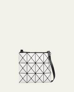 BAO BAO ISSEY MIYAKE "Lucent" fauxleather (PVC) geometric tile crossbody clutch. Adjustable shoulder strap. Lightweight, collapsible style for easy travel. Easy to clean (wipe with damp cloth); mesh lining. Recessed, extended zip top closure. Jacquardlined interior. One zip pocket. 9"H x 13.4"W x 2"D. Made in Japan. Luxury Geometric Shoulder Bag With Removable Pouch, Modern Geometric Shoulder Bag With Adjustable Strap, Modern Geometric Bag With Adjustable Strap, Luxury Geometric Shoulder Bag For Everyday Use, Luxury Geometric Bag With Removable Pouch, Luxury Bag With Removable Geometric Pouch, Geometric Bag With Adjustable Strap, Geometric Travel Bag With Adjustable Strap, Travel Bags With Adjustable Strap And Geometric Shape