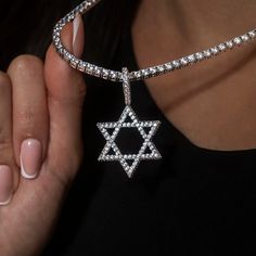 Introducing the Diamond Pave Star of David Pendant- a symbol of protection, unity, and connection. Crafted with detail and care, this pendant shines with hand-set baguette stones, honoring the Jewish religion. Whether worn as a statement piece or as a daily reminder of faith and tradition, this pendant seamlessly blends style with spirituality. Pair it with a Diamond Tennis Necklace for a set that will shine! This product is guaranteed for life - GLD will repair the item should you experience an Luxury Silver Star Of David Jewelry, Luxury White Gold Star Of David Jewelry, Silver Cubic Zirconia Star Of David Jewelry, White Gold Star Of David Jewelry, White Gold Cubic Zirconia Star Of David Jewelry, Diamond White Star Of David Jewelry Gift, Silver Star Of David Necklace Tarnish Resistant, White Gold Star Of David Spiritual Jewelry, Luxury Sterling Silver Star Of David Jewelry