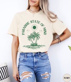 🏝️Discover our Tropical Paradise State of Mind Comfort Colors summer beach vacation shirt!🏝️  This trendy Palm tree beach t-shirt features an eye-catching green graphic design that is sure to enhance your next beach vacation! Made of 100% ring-spun ethically grown cotton, this shirt is super soft and comfortable. It has a relaxed fit which is made of a medium fabric that is preshrunk. Looks super cute with shorts, jeans or as an oversized beach cover up. Great gift for a Beach Lover! Comes in 10 pretty colors! 💠PRINT: This is a handmade, Direct-to-Garment printed item. The designs are professionally printed directly on to the shirt. All over printing is used. The ink is printed directly into the fabric. ✦Images may sometimes appear larger in the photo than in person due to images being Fabric Images, Palm Trees Beach, Summer Beach Vacation, Pretty Colors, Beach Lover, Beach T Shirts, Comfort Wear, Vacation Shirts, Shorts Jeans