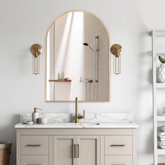 a bathroom vanity with two sinks and a large mirror