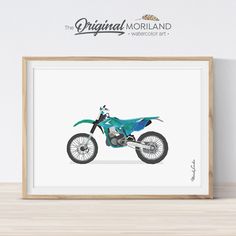 a blue dirt bike is on display in a wooden frame, next to a white wall