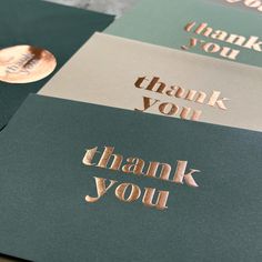 three thank you cards with gold foil on the front and back, in different colors