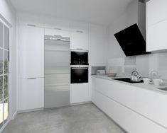 a modern kitchen with white cabinets and stainless steel appliances