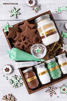 an assortment of cookies and candy in a wooden box