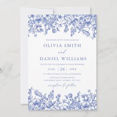 a blue and white wedding card with floral design on the front, featuring an image of flowers