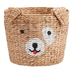 a basket with a bear face painted on the front and bottom, sitting in front of a white background