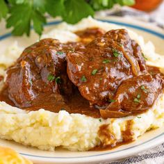 meat and gravy on top of mashed potatoes