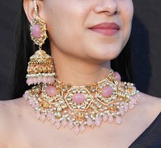 Adorn yourself with the exquisite allure of this Pink Polki Necklace Set by renowned designer Sabyasachi. Immerse in the regal beauty of Kundan Jewelry, featuring a blush pink Kundan choker adorned with intricate Jadau work. This bridal jewelry ensemble showcases the timeless elegance of Polki, exuding a captivating charm that perfectly complements your special day. Indulge in opulence and grace with the enchanting Polki choker, a masterpiece of artistry and luxury. *𝐏𝐑𝐎𝐃𝐔𝐂𝐓 𝐃𝐄𝐓𝐀𝐈𝐋* Luxury Pink Kundan Bridal Necklace, India Necklace, Pink Jewelry Set, Kundan Jewellery Set, Sabyasachi Jewellery, Polki Necklace, Kundan Necklaces, Kundan Jewellery, Indian Jewelry