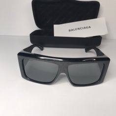 Balenciaga Black Bb0002s Shield Sunglasses A Statement Pair Of Sunglasses From Balenciaga Will Surely Make A Prized Buy. Featuring A Trendy Frame And Lenses Meant To Protect Your Eyes, The Sunglasses Are Ideal For All-Day Wear. Gender Men Includes Info Booklet, Original Dust Cloth, Original Case Origin Italy Material Acetate Hardware Gunmetal Tone Eye Size 63 Mm Temple Length 125 Mm Bridge Size 14 Mm Designer Shield Sunglasses With Uv Protection Square Frame, Designer Black Shield Sunglasses With Square Frame, Designer Black Shield Sunglasses With Uva Protection, Designer Shield Sunglasses For Summer, Designer Black Sunglasses With Uva Protection, Luxury Black Polarized Shield Sunglasses, Designer Shield Sunglasses With Tinted Lenses For Evening, Designer Shield Sunglasses With Tinted Lenses For Formal Occasions, Designer Shield Sunglasses With Tinted Lenses For Formal Events