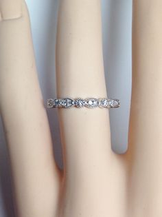 a close up view of a ring on a mannequin's hand,