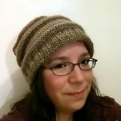 a woman wearing glasses and a knitted hat