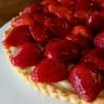 there is a pie with strawberries on it